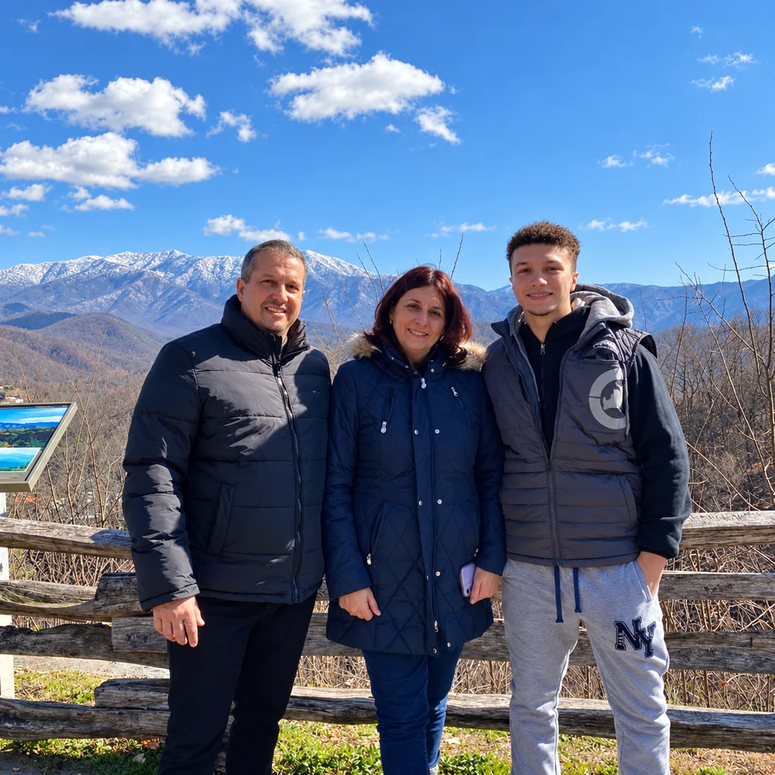 Alex with his family at a mountain overlook